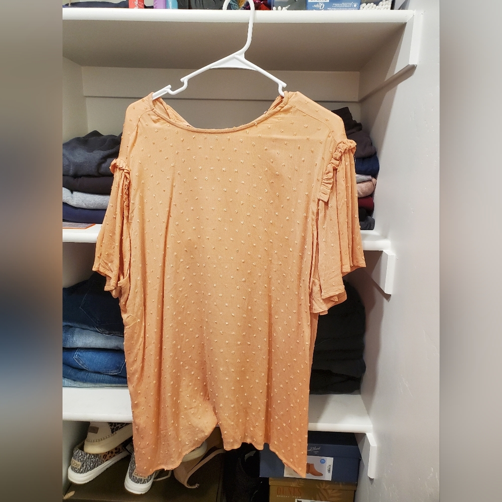 Peach color shirt. Super flowy. Size medium  fits more like a large